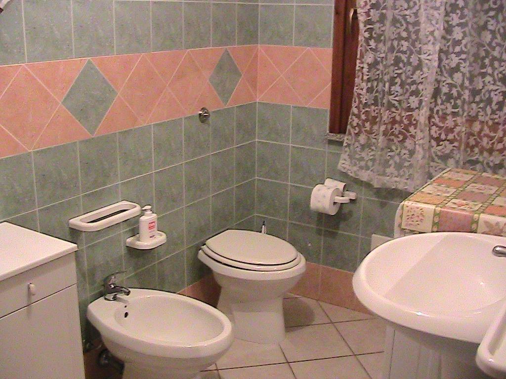 Casa Giovanna Porto Pino Værelse billede